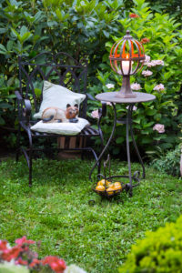 Chair and table made of iron with candle and decoration in the garden Chair and table made of iron with candle and decoration in the garden